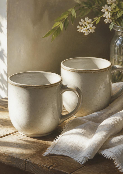La couverture du livre « On s'aime encore, mais on s'est perdus » — deux tasses sur une table de bois, lumière du matin